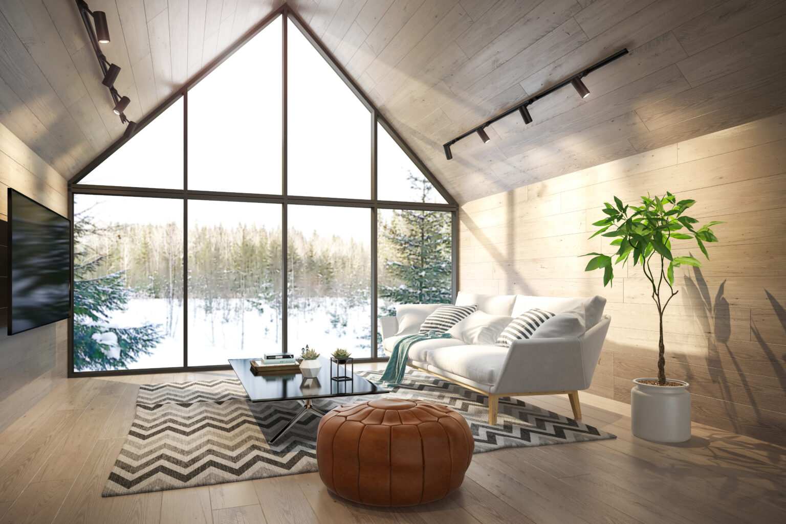 An A-frame cabin living room with a tall window onto snow and pines